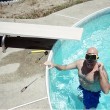 jim fixing the light in the pool