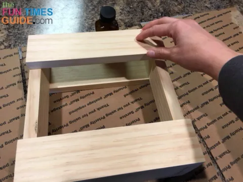 Gluing the horizontal boards to the other side of the frame for this wooden utensil holder.