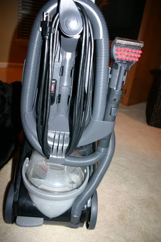 Back view of the Bissell Proheat showing all of the on-board tools you can use for cleaning carpet stains.