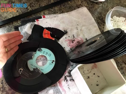 I had plenty of extra 45 vinyl records to replace the ones that broke during the drilling process. If you use 2 clamps to create even tension, the drilling shouldn't break any records.
