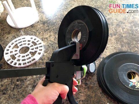 Here, I'm clamping one stack of vinyl records with a bar clamp.