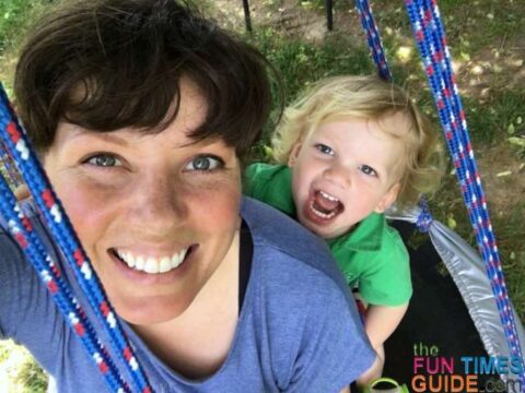 I'm SUPER happy with my first DIY tree swing! This trampoline swing enables us to have hours of fun outdoors. photo by Candida at TheFunTimesGuide.com