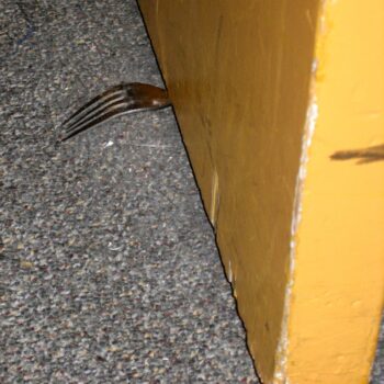 A fork used as a DIY door stop as featured on The Daily Clog.