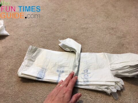 See how to roll plastic bags yourself into self-dispensing bundles.