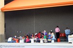 Kids participating in a hands-on workshop at the local Home Depot.
