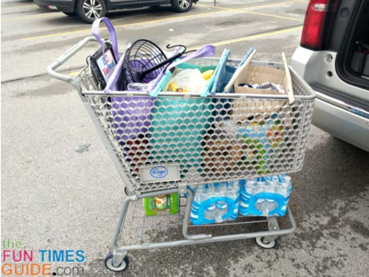lotus-trolley-bags-with-heavy-items-underneath In addition to the heavy items on the very bottom of the cart, I also had a 12-pack of green tea and a sack of potatoes in the bottom of my cart. The Lotus Trolley Bags fit perfectly in the cart -- right over those 2 items.