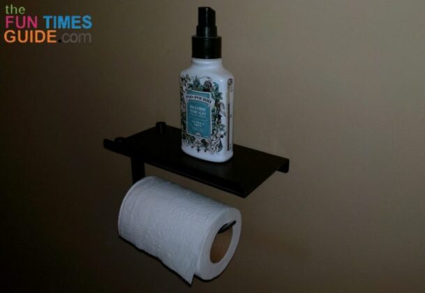 This toilet paper shelf is perfect for holding a bottle of Poo Pourri toilet spray in the guest bathroom! 