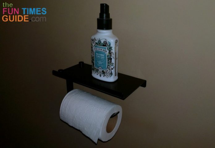This toilet paper shelf is perfect for holding a bottle of Poo Pourri toilet spray in the guest bathroom!