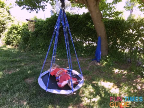 As you can see, this saucer swing is the perfect size for my toddler son, but it's not big enough for both of us to lounge on it together.
