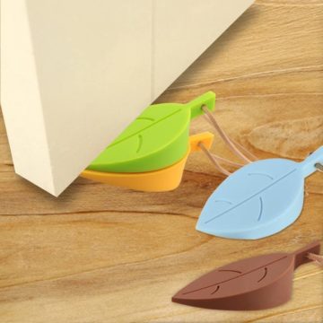 A set of 4 different colored silicone leaves that hang on the door handle when not in use as a doorstopper.