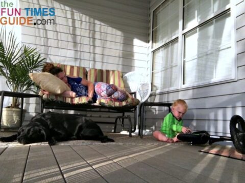 Enjoying our breezy porch with baby and pets - it's a cozy outdoor space now!