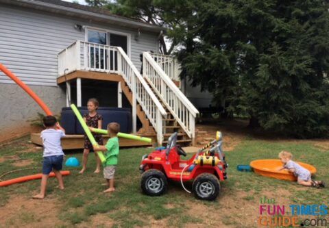 My son and neighborhood kiddos playing in our backyard - notice the Softub in the background.