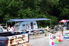 A traveling salesman... selling yard sale items and flea market items from his mobile trailer.