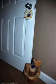 Using decorative tree stumps as a doorstopper. photo by Lynnette at TheFunTimesGuide.com