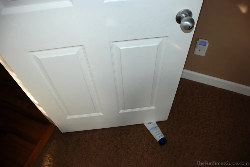 Using a tube bottle as a door stop. photo by Lynnette at TheFunTimesGuide.com