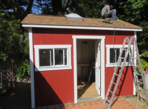 Installing the Tuff Shed roof. 