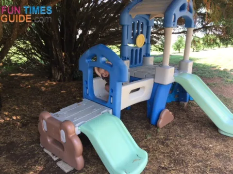 I decided to put the Little Tikes outdoor climber under the shade of our cypress trees in the backyard.