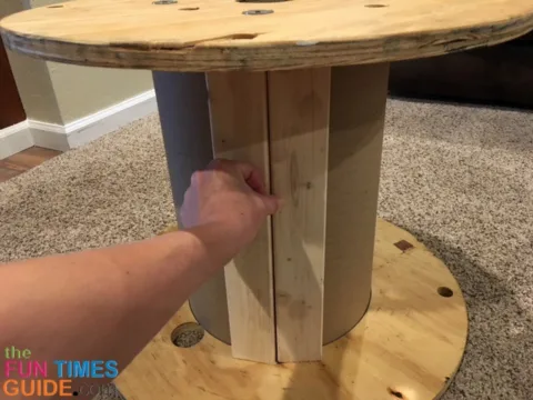 I covered the cardboard center core of the wooden spool with scrap wood pieces.