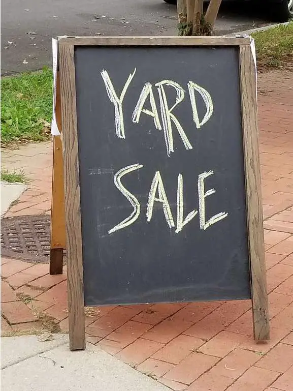 This chalkboard style of sandwich board is being used as a yard sale sign. Tent-shaped sign boards are a great way to attract attention to your sale!