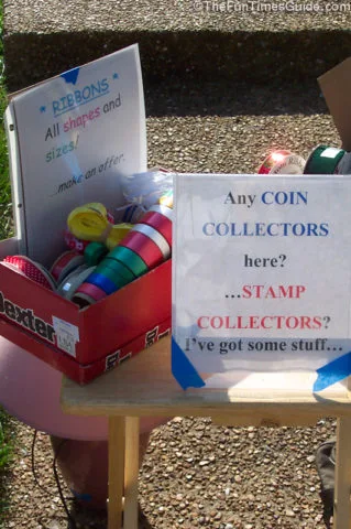 The example in the back (left) is a page protector describing what's in the box and the price. The example in the front (right) is an acrylic frame with a special message to any collectors visiting my yard sale.